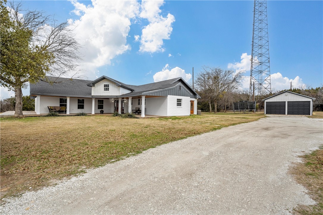 15966 Old China Spring Road China Spring, TX 76633 - Photo 6 of 45 a front view of a house with a yard