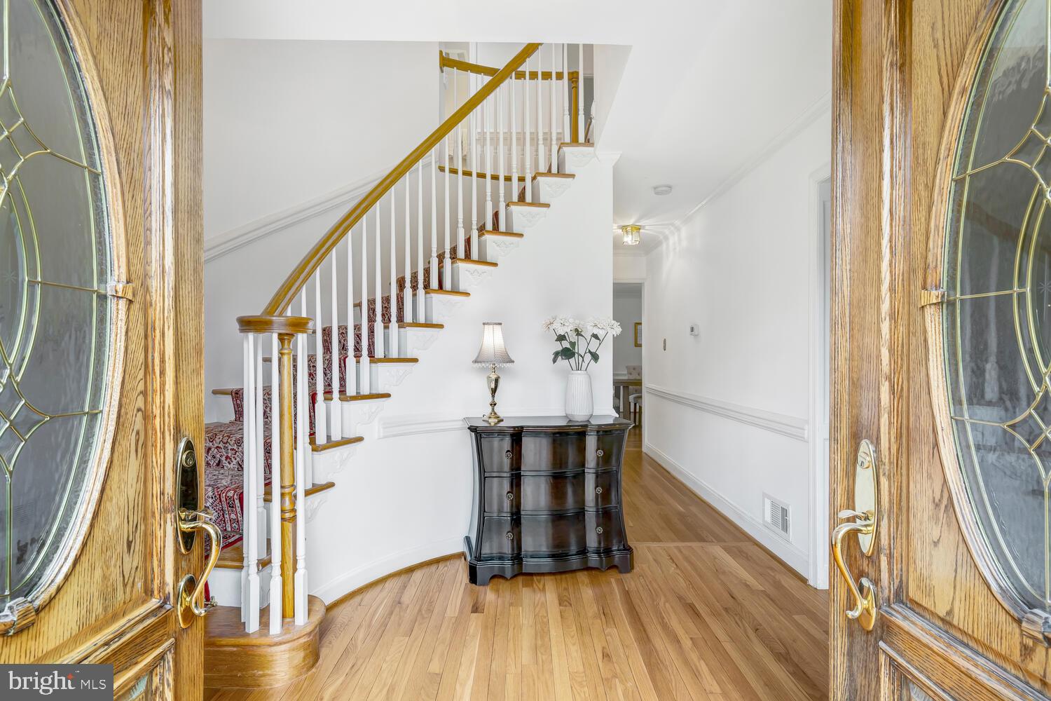 723 Forest Park Road Great Falls, VA 22066 - Photo 11 of 71 a view of a hallway with wooden floor and staircase
