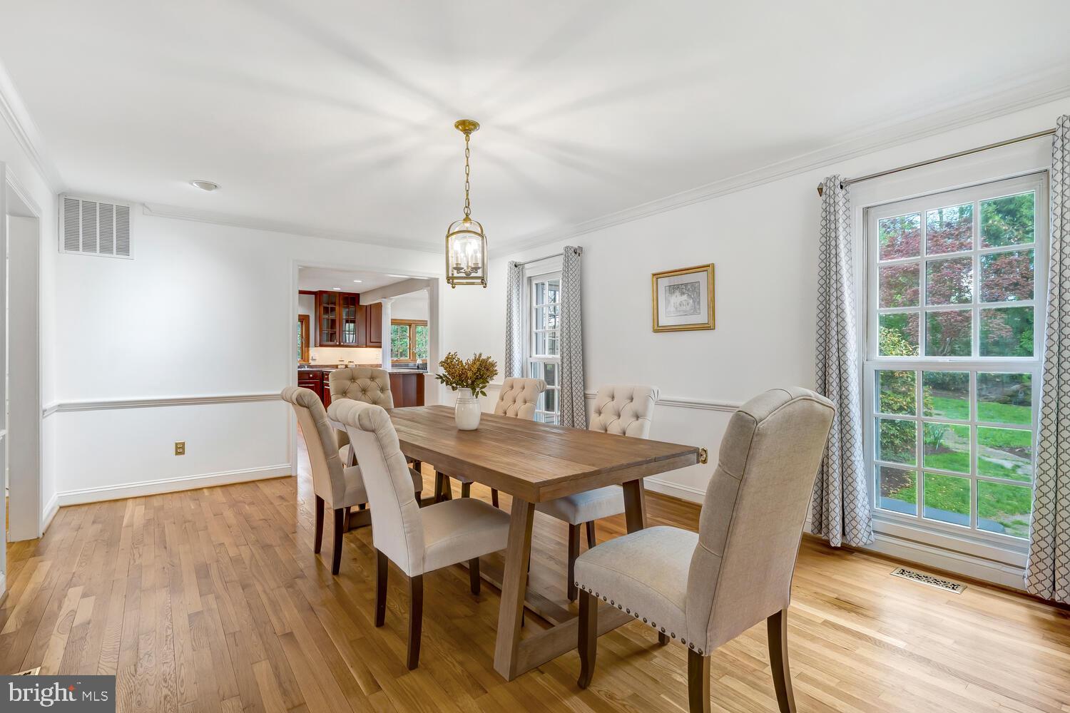 723 Forest Park Road Great Falls, VA 22066 - Photo 19 of 71 a view of a dining room with furniture window and wooden floor