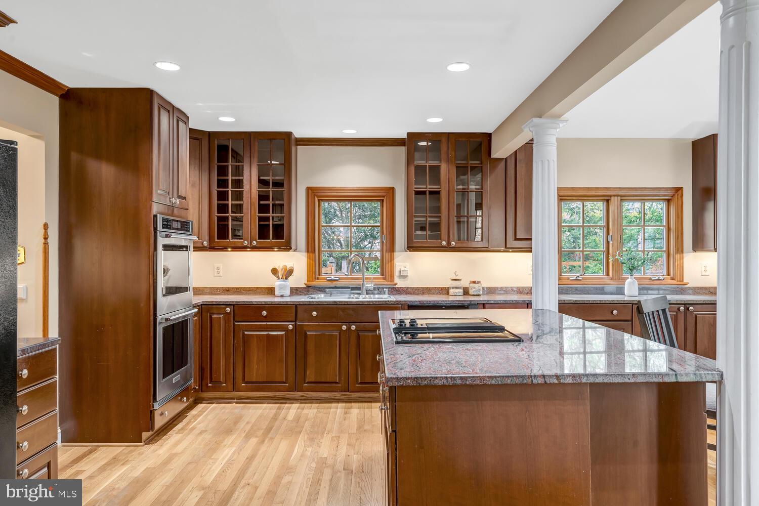 723 Forest Park Road Great Falls, VA 22066 - Photo 3 of 71 a kitchen with stainless steel appliances granite countertop a sink and wooden cabinets