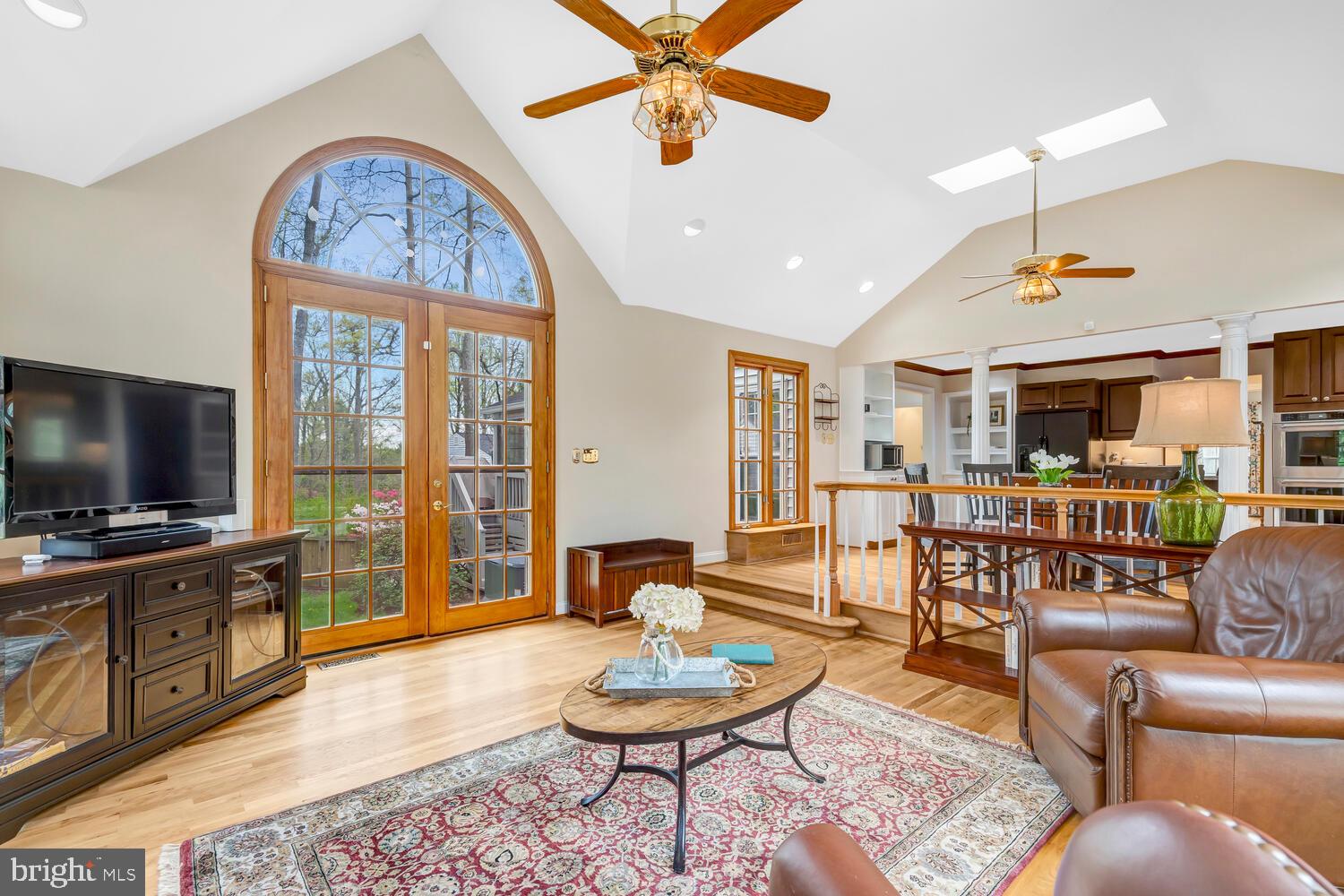 723 Forest Park Road Great Falls, VA 22066 - Photo 30 of 71 a living room with furniture a flat screen tv and a table