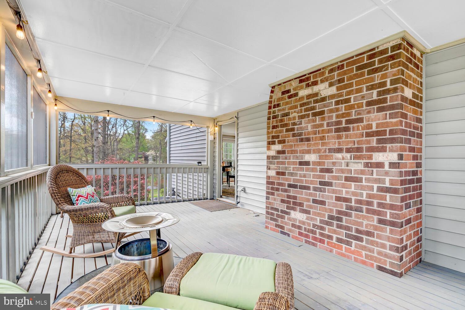 723 Forest Park Road Great Falls, VA 22066 - Photo 46 of 71 a living room with furniture and a floor to ceiling window