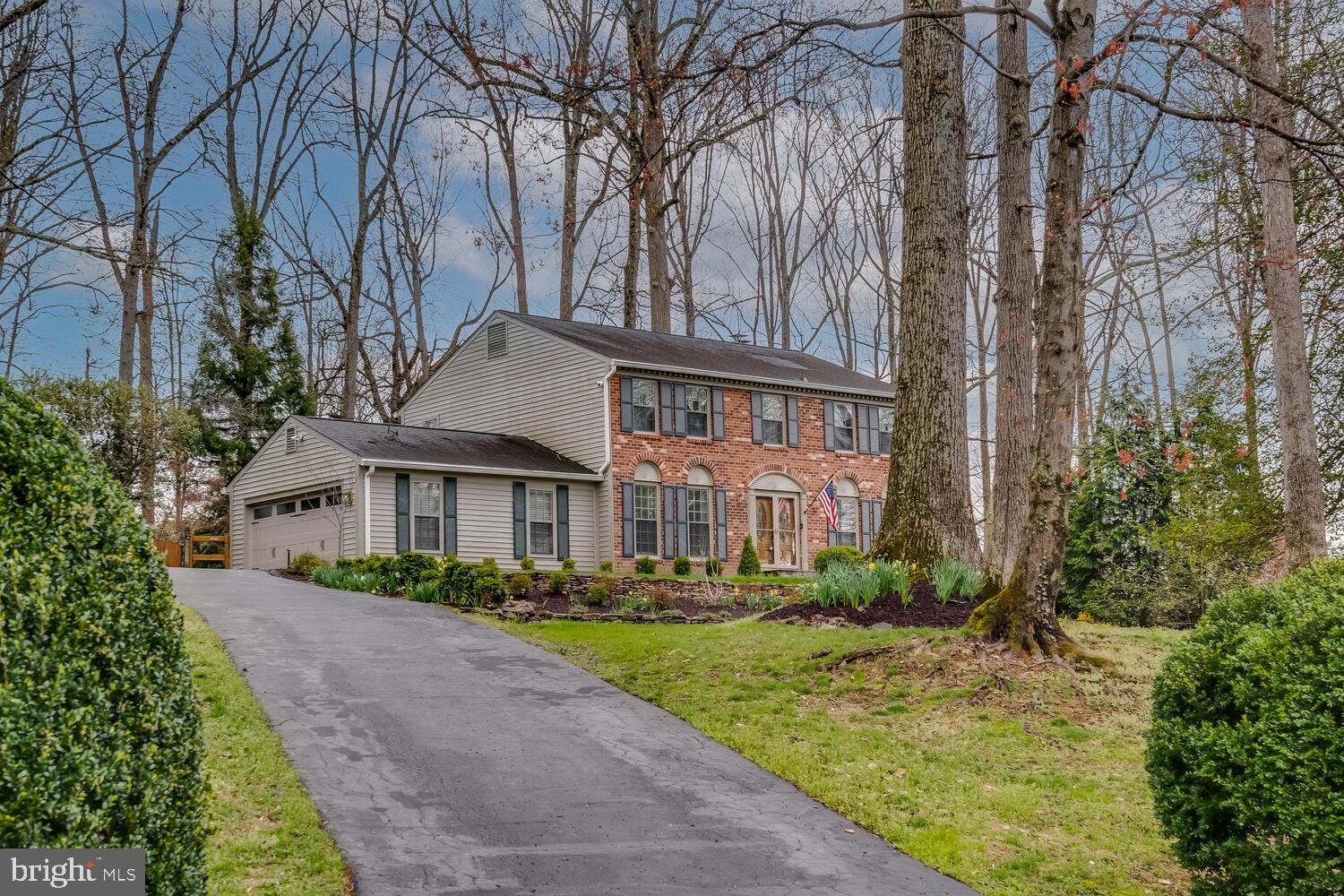 723 Forest Park Road Great Falls, VA 22066 - Photo 48 of 71 a front view of a house with a garden and trees