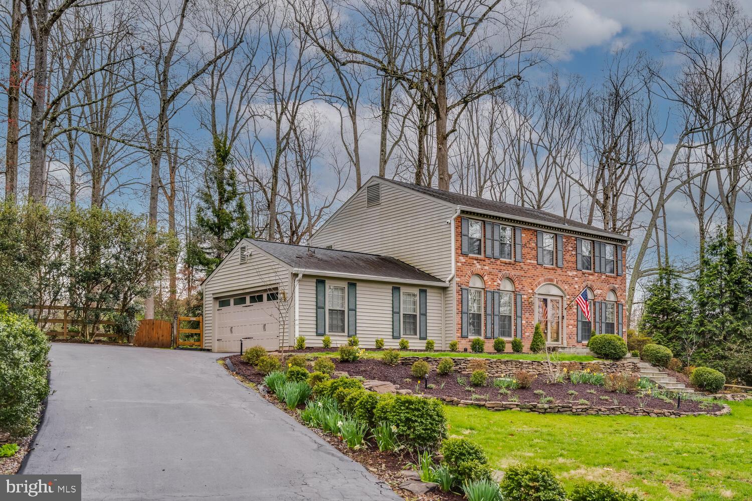 723 Forest Park Road Great Falls, VA 22066 - Photo 49 of 71 a front view of a residential houses with yard and green space