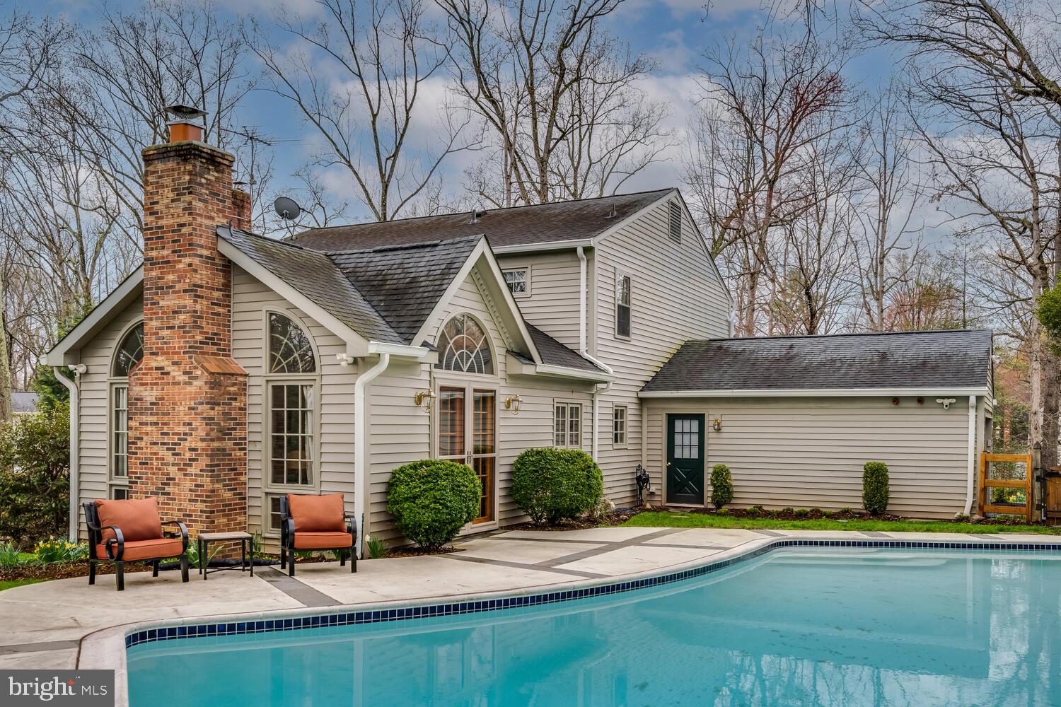723 Forest Park Road Great Falls, VA 22066 - Photo 55 of 71 a front view of a house with a yard and garage