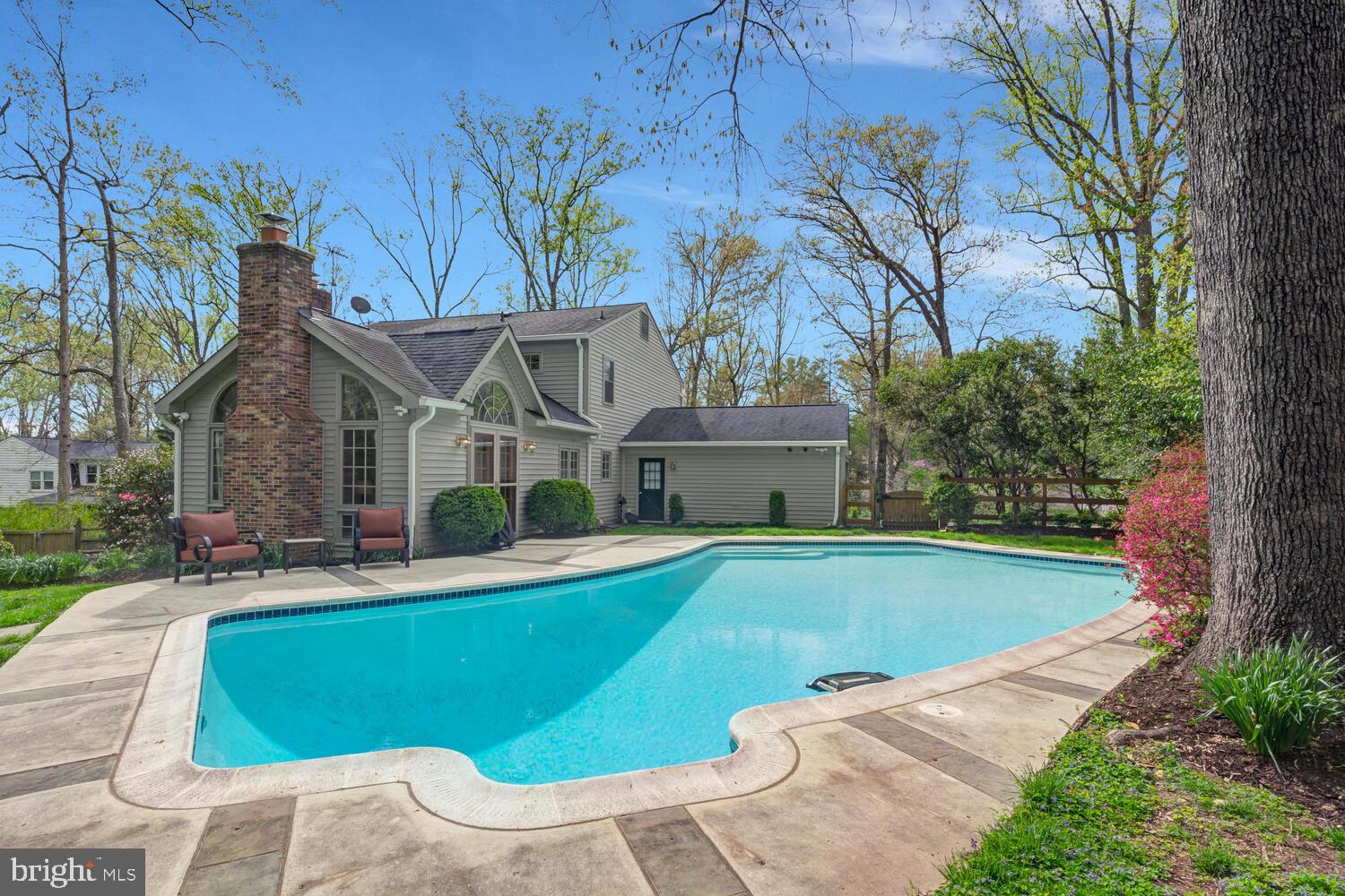 723 Forest Park Road Great Falls, VA 22066 - Photo 56 of 71 a view of a house with pool and chairs
