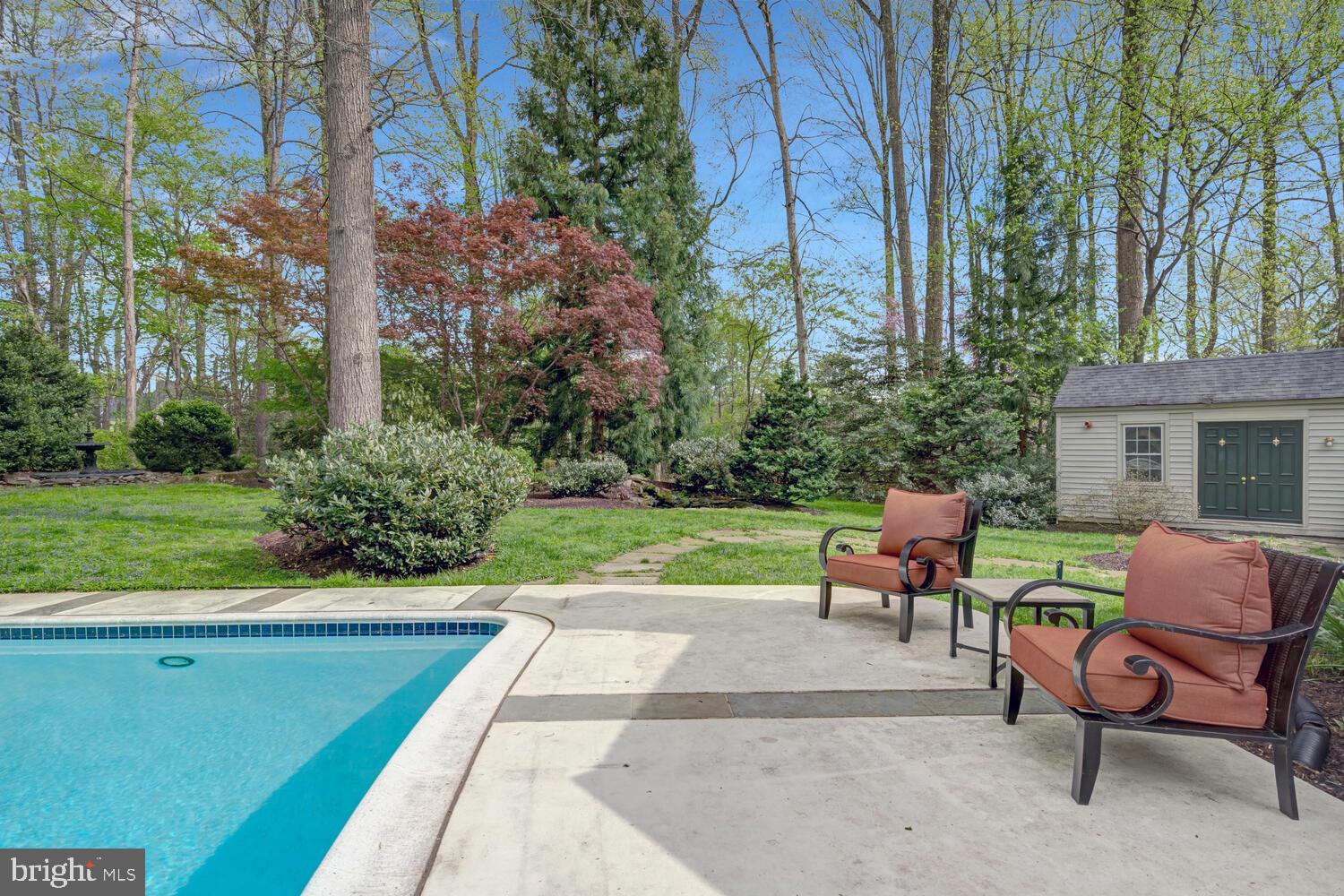 723 Forest Park Road Great Falls, VA 22066 - Photo 58 of 71 a view of patio with table and chairs and potted plants