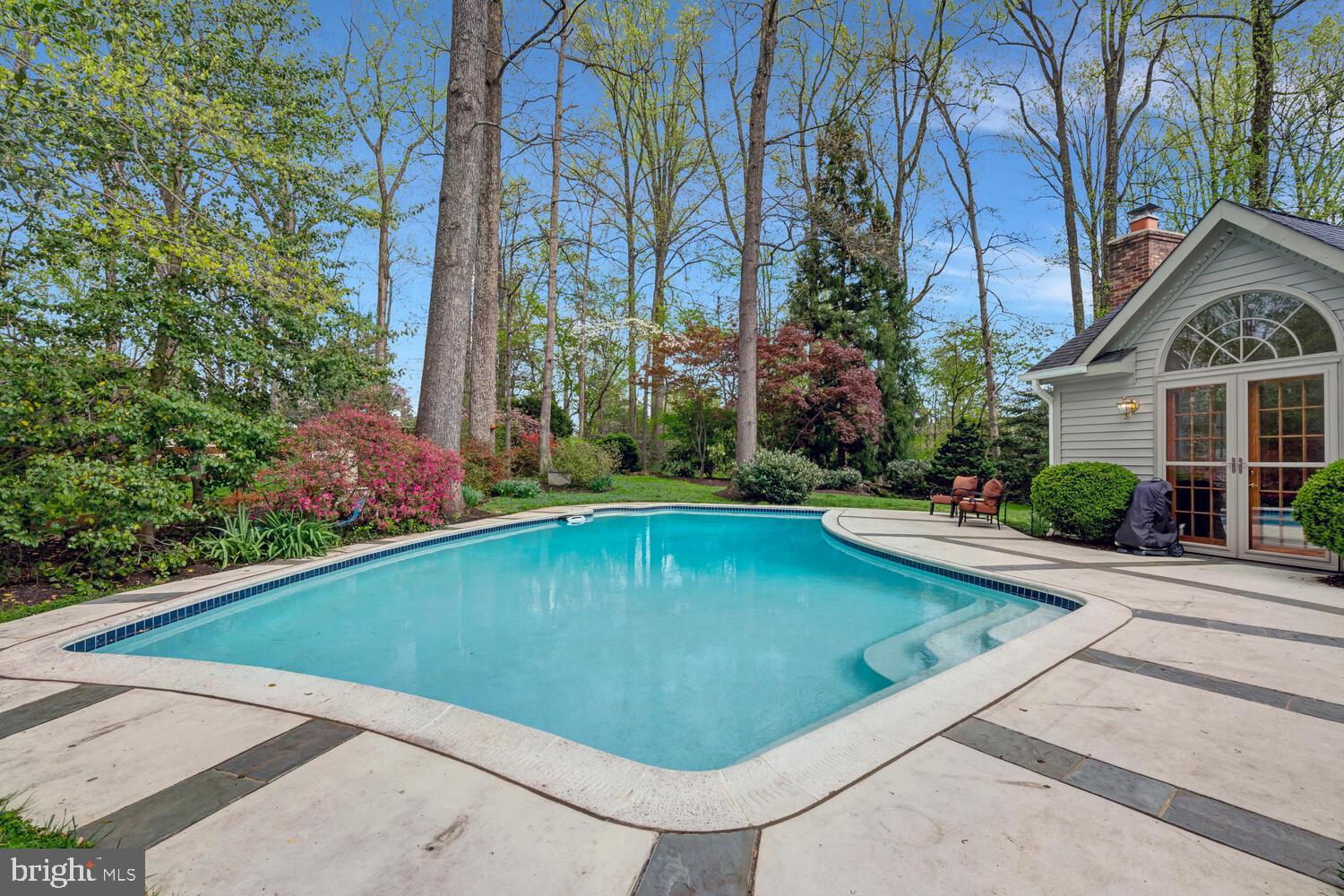723 Forest Park Road Great Falls, VA 22066 - Photo 60 of 71 a view of swimming pool on a sunny day with lawn chairs