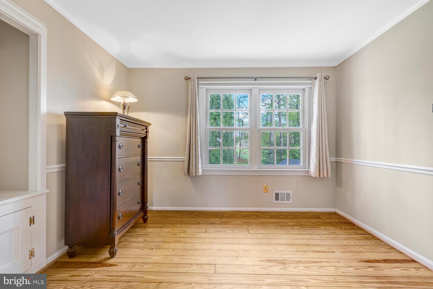 723 Forest Park Road Great Falls, VA 22066 - Photo 7 of 71 a view of empty room with wooden floor and fan