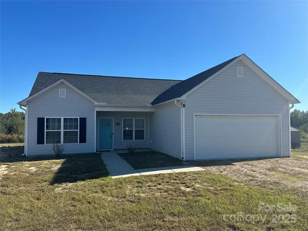 a house with yard in front of it