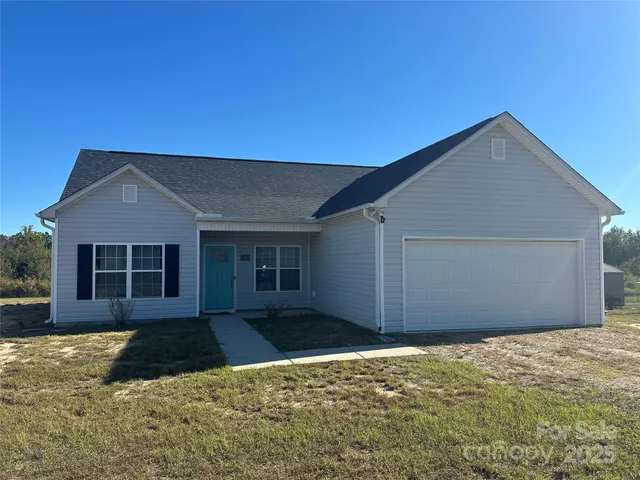 a house with yard in front of it