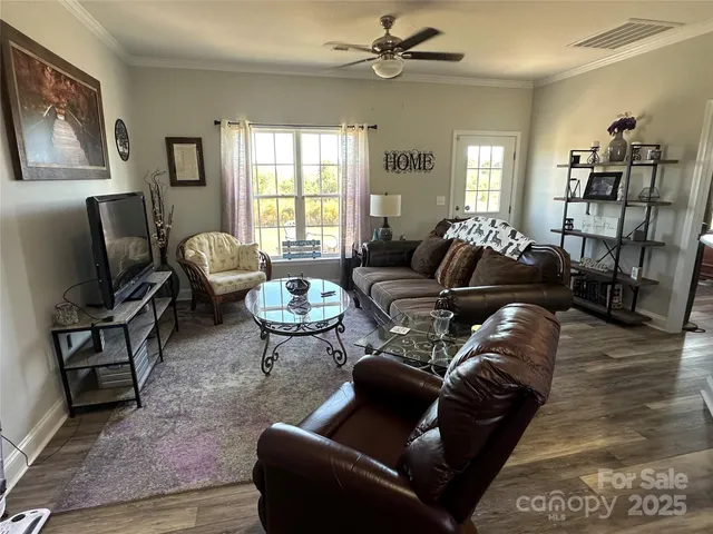 a living room with furniture or couch and a window
