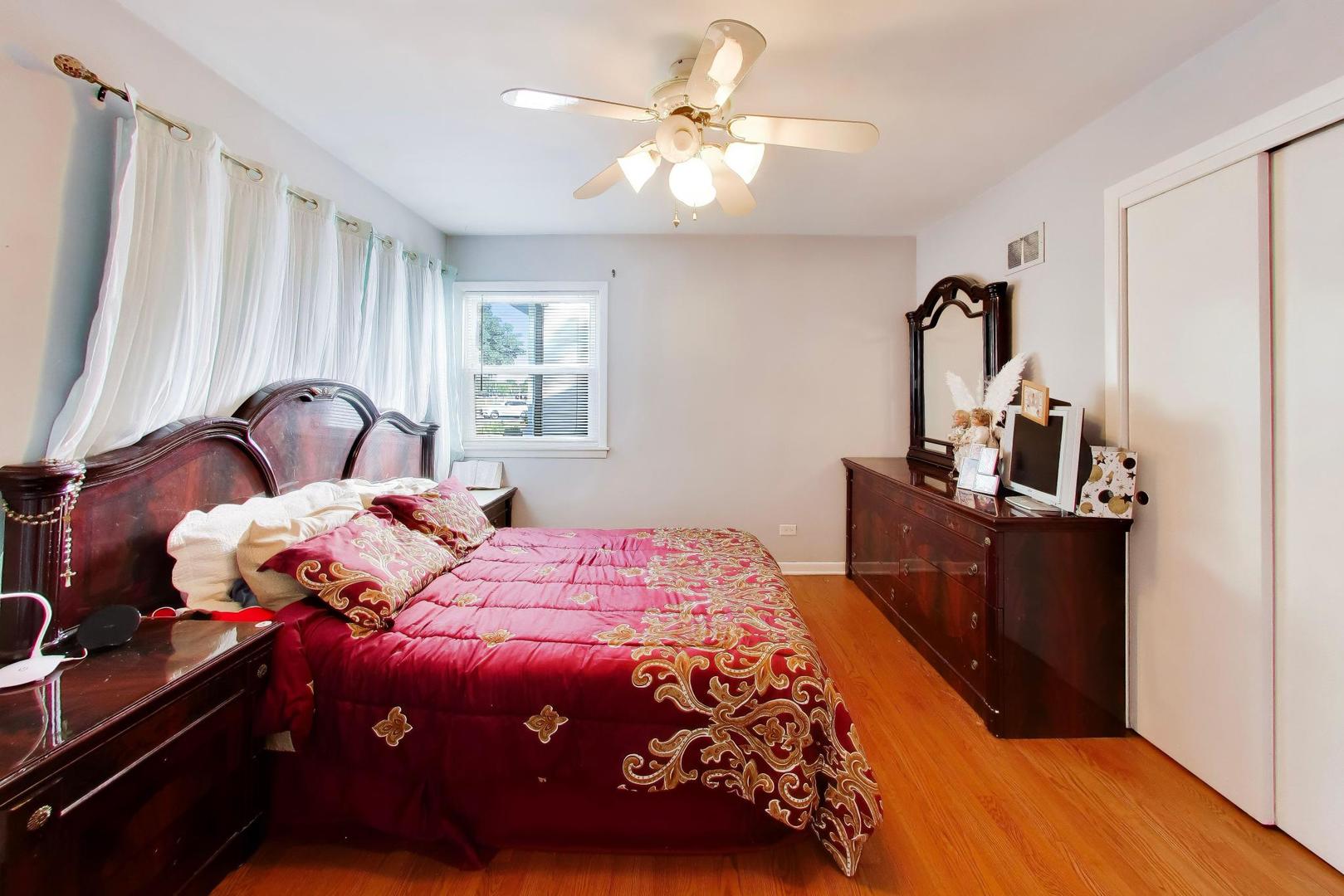 458 West Alma Street Elmhurst, IL 60126 - Photo 8 of 29 a bedroom with a bed and wooden floor