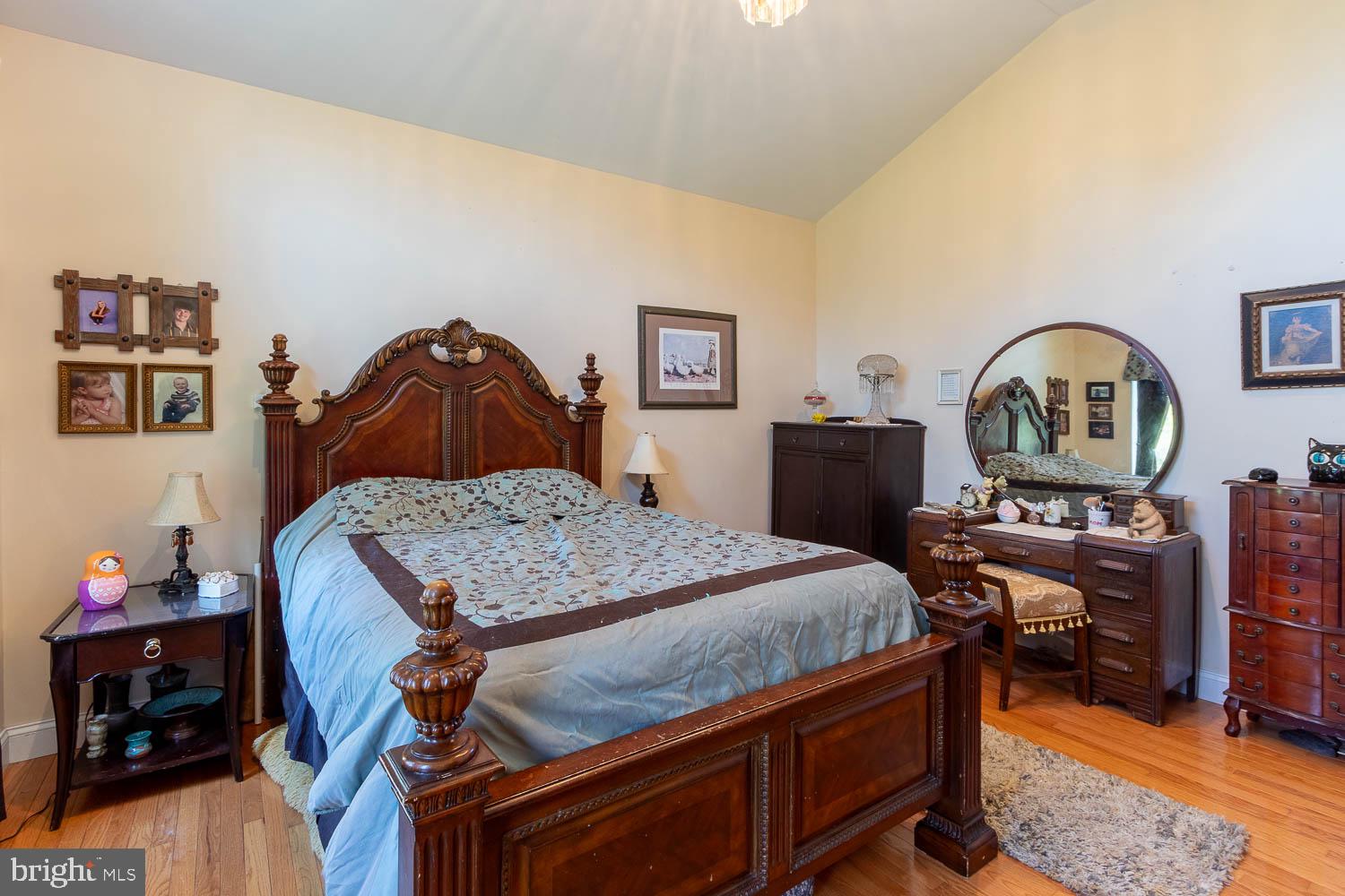 321 Mount Nittany Road Lemont, PA 16851 - Photo 13 of 43 a bedroom with a bed and a dresser in it