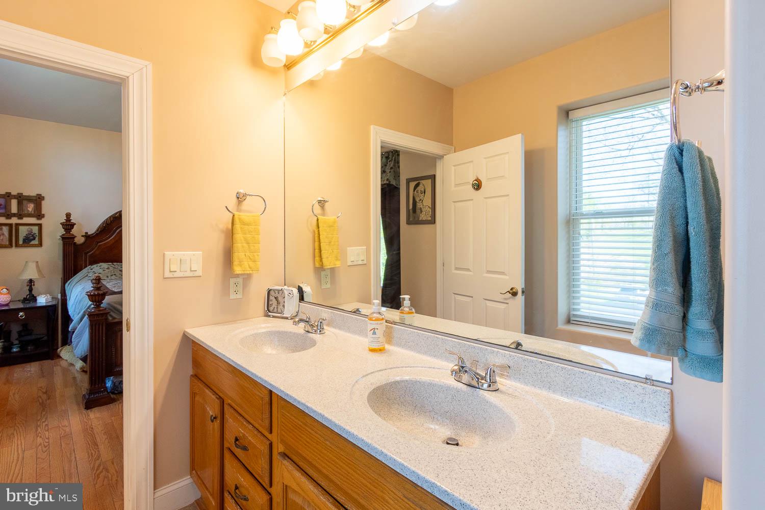 321 Mount Nittany Road Lemont, PA 16851 - Photo 15 of 43 a bathroom with a double vanity sink and a mirror