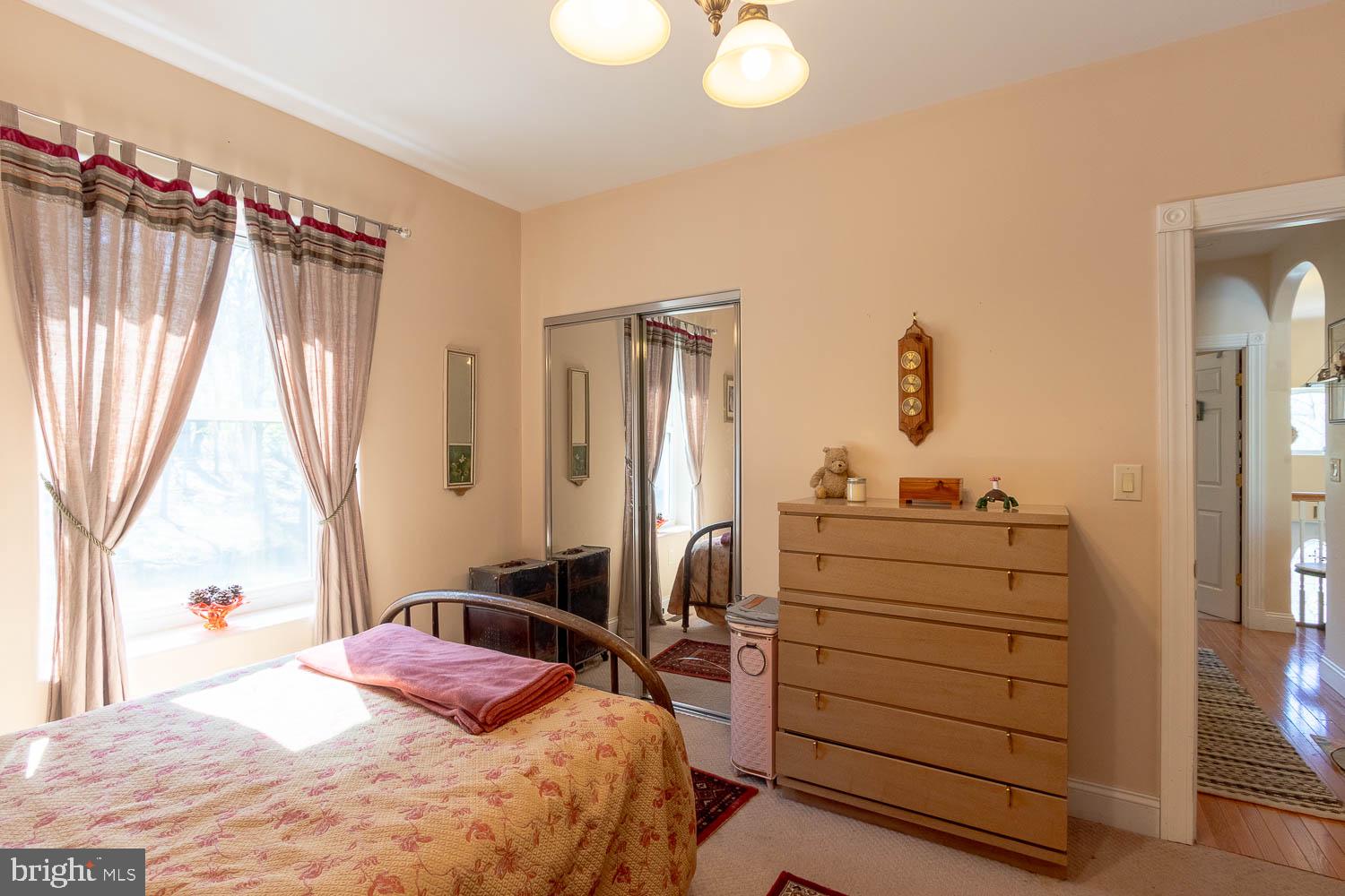 321 Mount Nittany Road Lemont, PA 16851 - Photo 21 of 43 a bedroom with a bed and a dresser