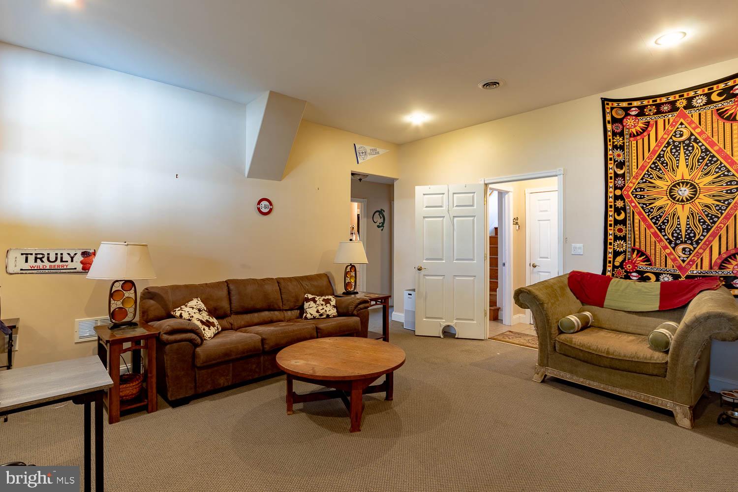 321 Mount Nittany Road Lemont, PA 16851 - Photo 30 of 43 a living room with furniture and a large window