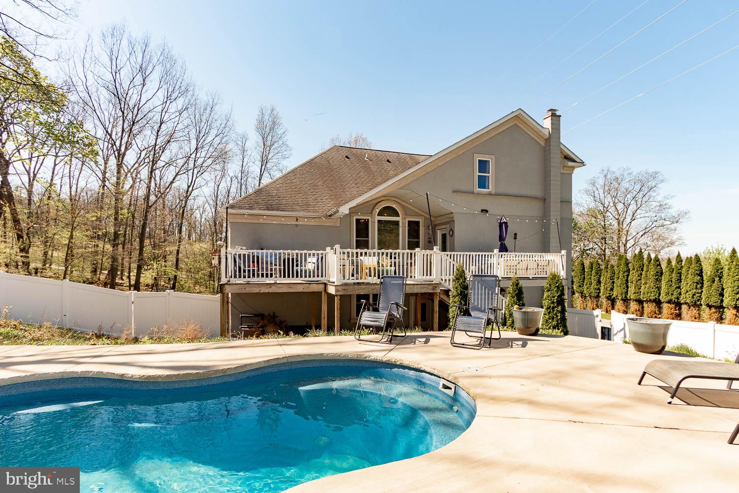 321 Mount Nittany Road Lemont, PA 16851 - Photo 41 of 43 a swimming pool with outdoor seating and yard
