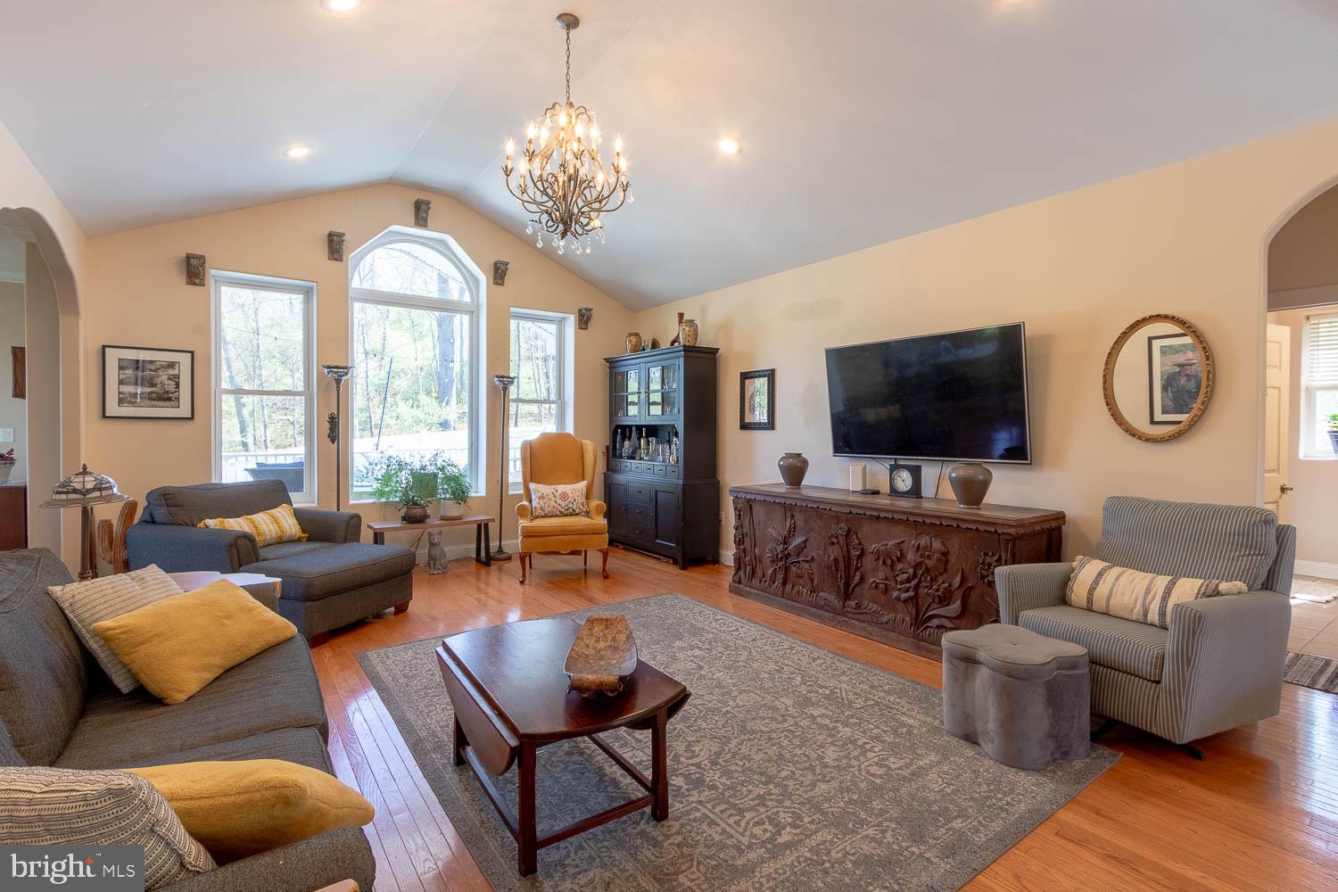 321 Mount Nittany Road Lemont, PA 16851 - Photo 5 of 43 a living room with furniture flat screen tv and wooden floor