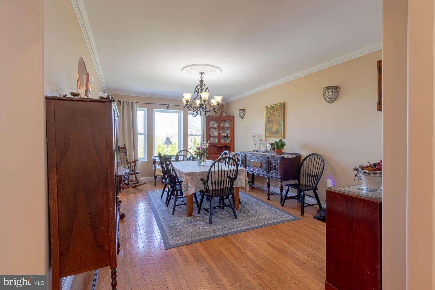 321 Mount Nittany Road Lemont, PA 16851 - Photo 6 of 43 a view of a dining room with furniture and chandelier