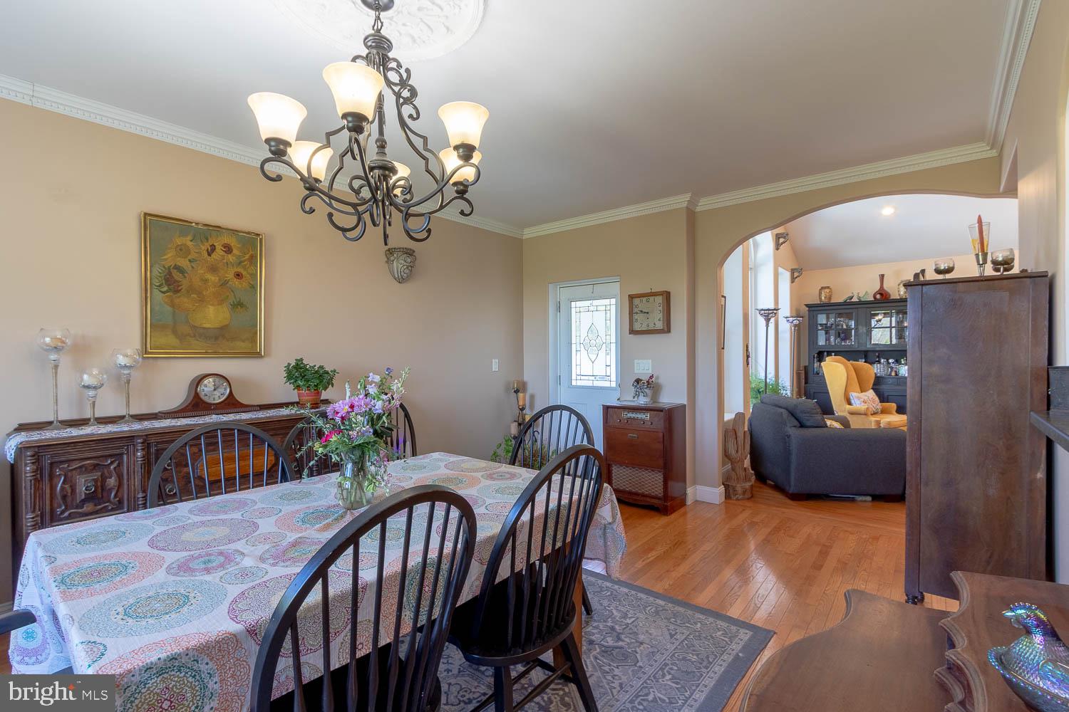 321 Mount Nittany Road Lemont, PA 16851 - Photo 7 of 43 a dining room with furniture a livingroom and chandelier