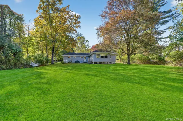 a view of a house with a big yard