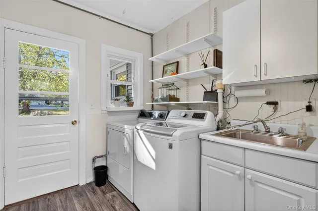 a view of a kitchen and a sink wooden floor