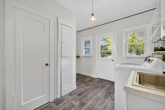 a white toilet sitting next to a bathroom sink