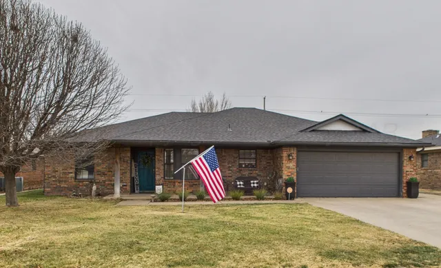 a vase of flowers sitting next to a window