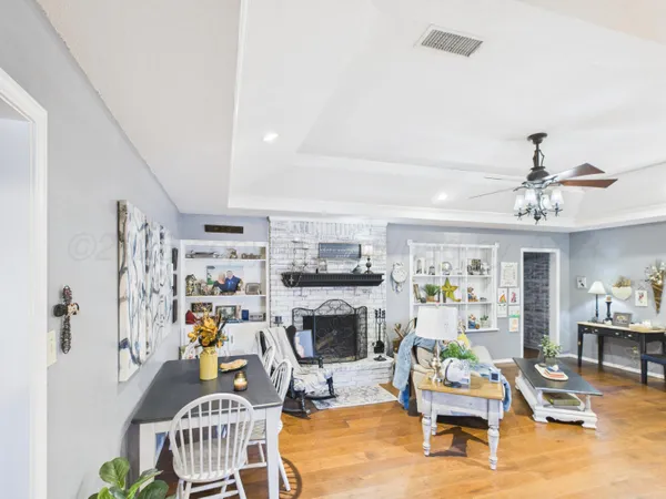 a living room with patio furniture and a window
