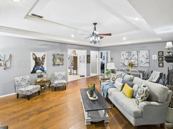 a kitchen with stainless steel appliances granite countertop a refrigerator a stove and a sink with granite countertops