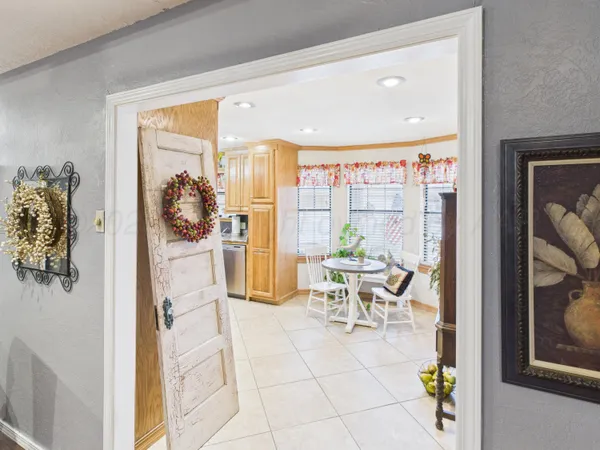 a kitchen with stainless steel appliances granite countertop a sink and a stove