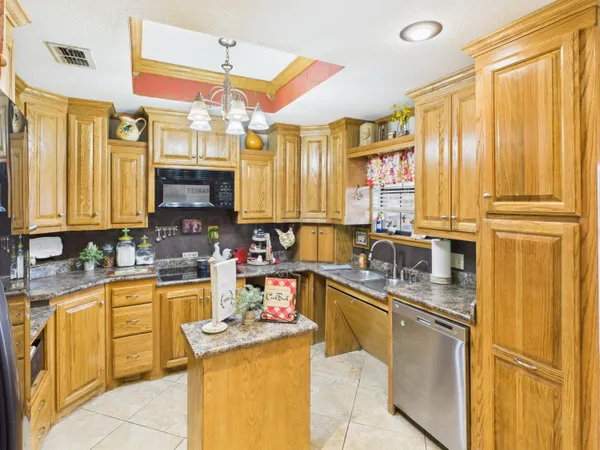 a living room with furniture and a bookshelf