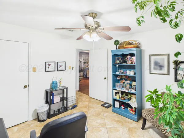 a bedroom with furniture and window