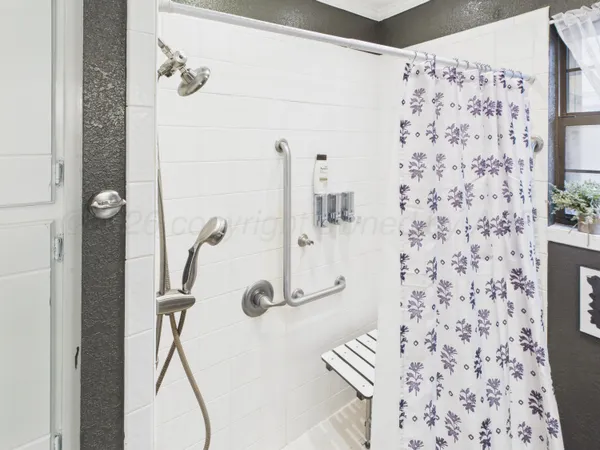 a view of a hallway with paintings on the wall