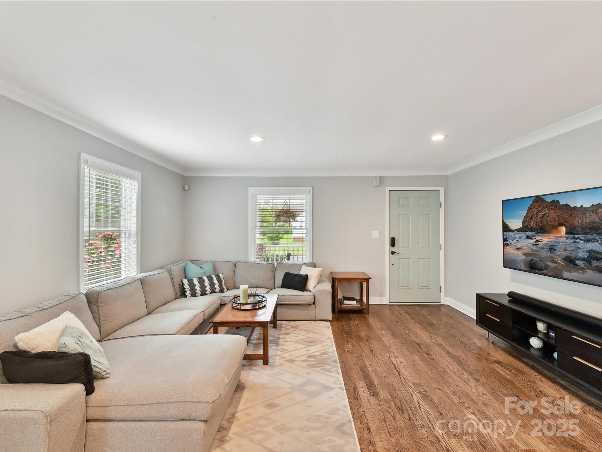 335 Greystone Road Charlotte, NC 28209 - Photo 11 of 37 a living room with furniture and a flat screen tv