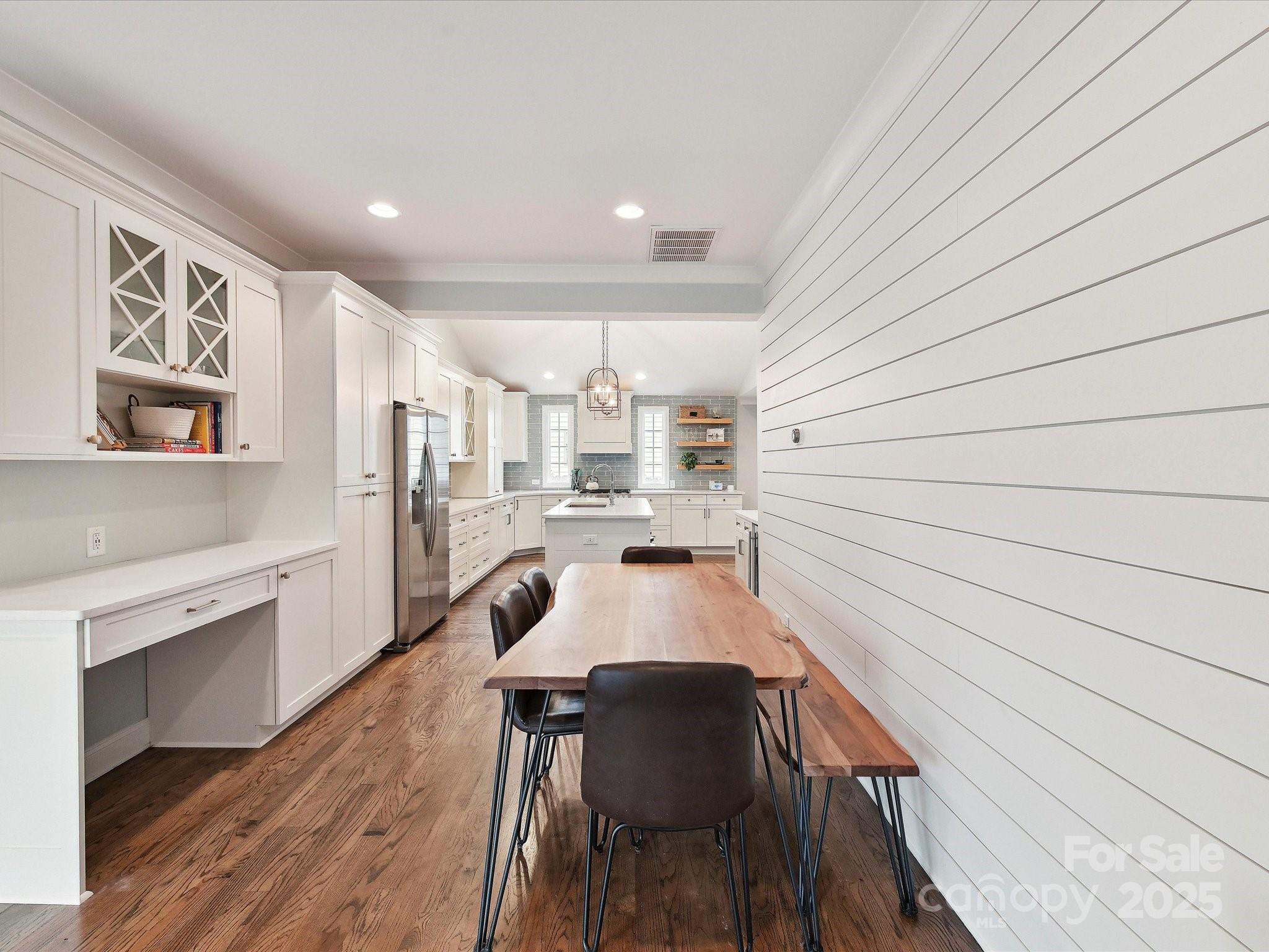 335 Greystone Road Charlotte, NC 28209 - Photo 12 of 37 a large white kitchen with sink and cabinets