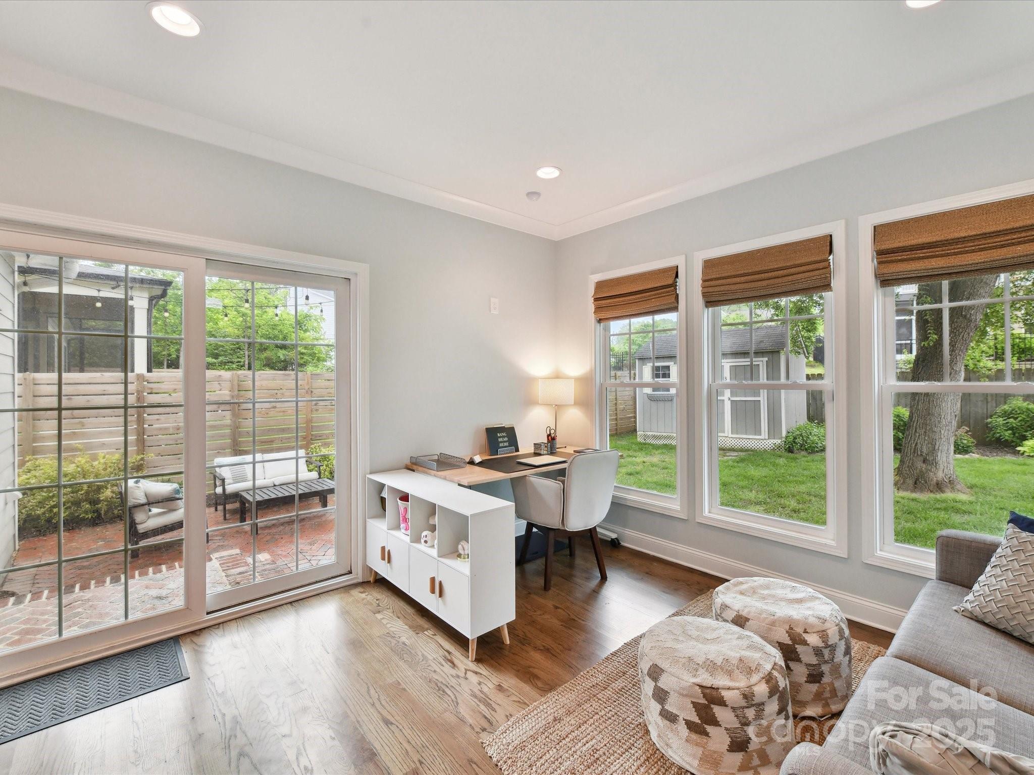 335 Greystone Road Charlotte, NC 28209 - Photo 15 of 37 a bed room with a bed and glass window