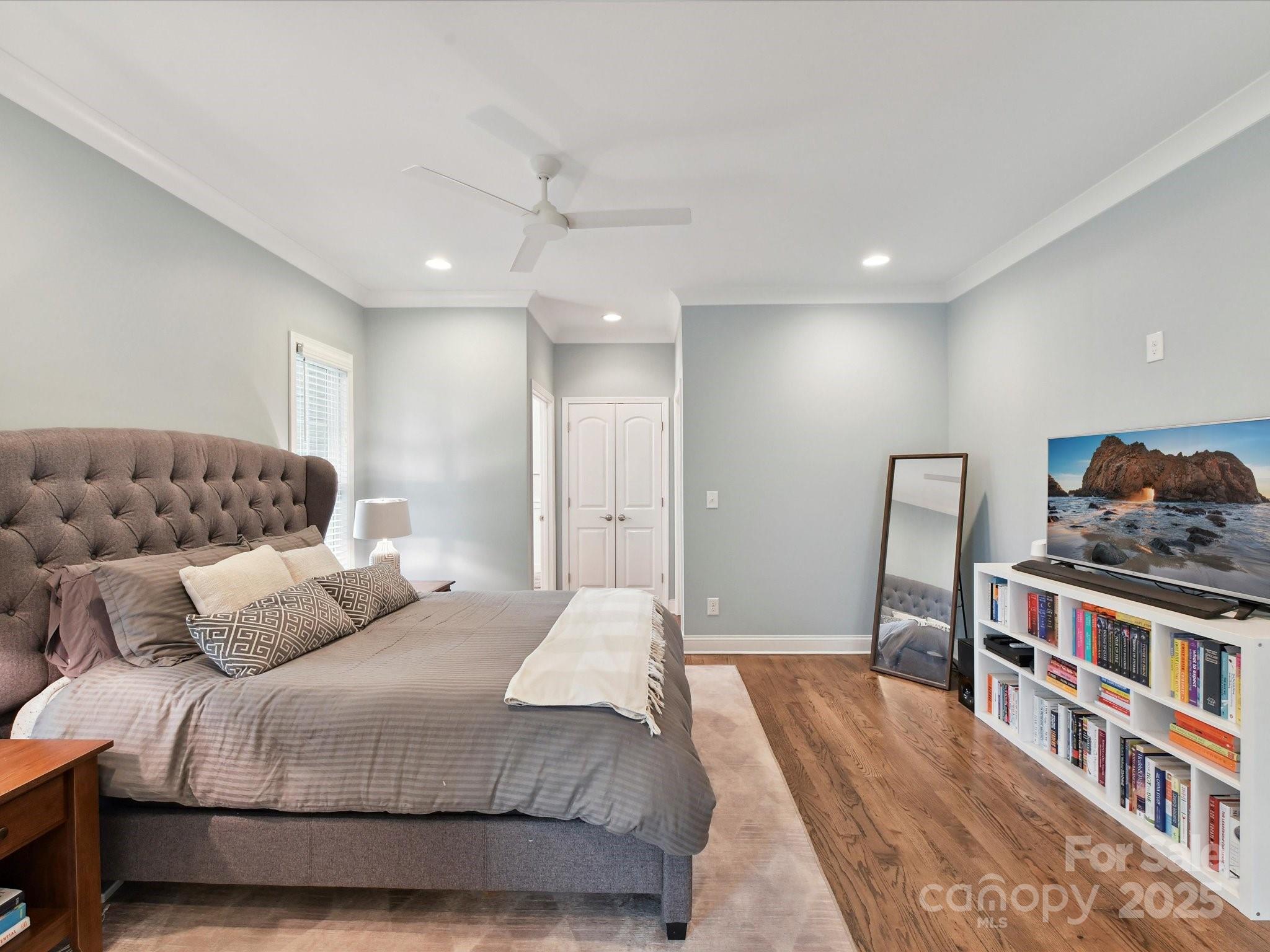 335 Greystone Road Charlotte, NC 28209 - Photo 18 of 37 a bedroom with a bed and a book shelf