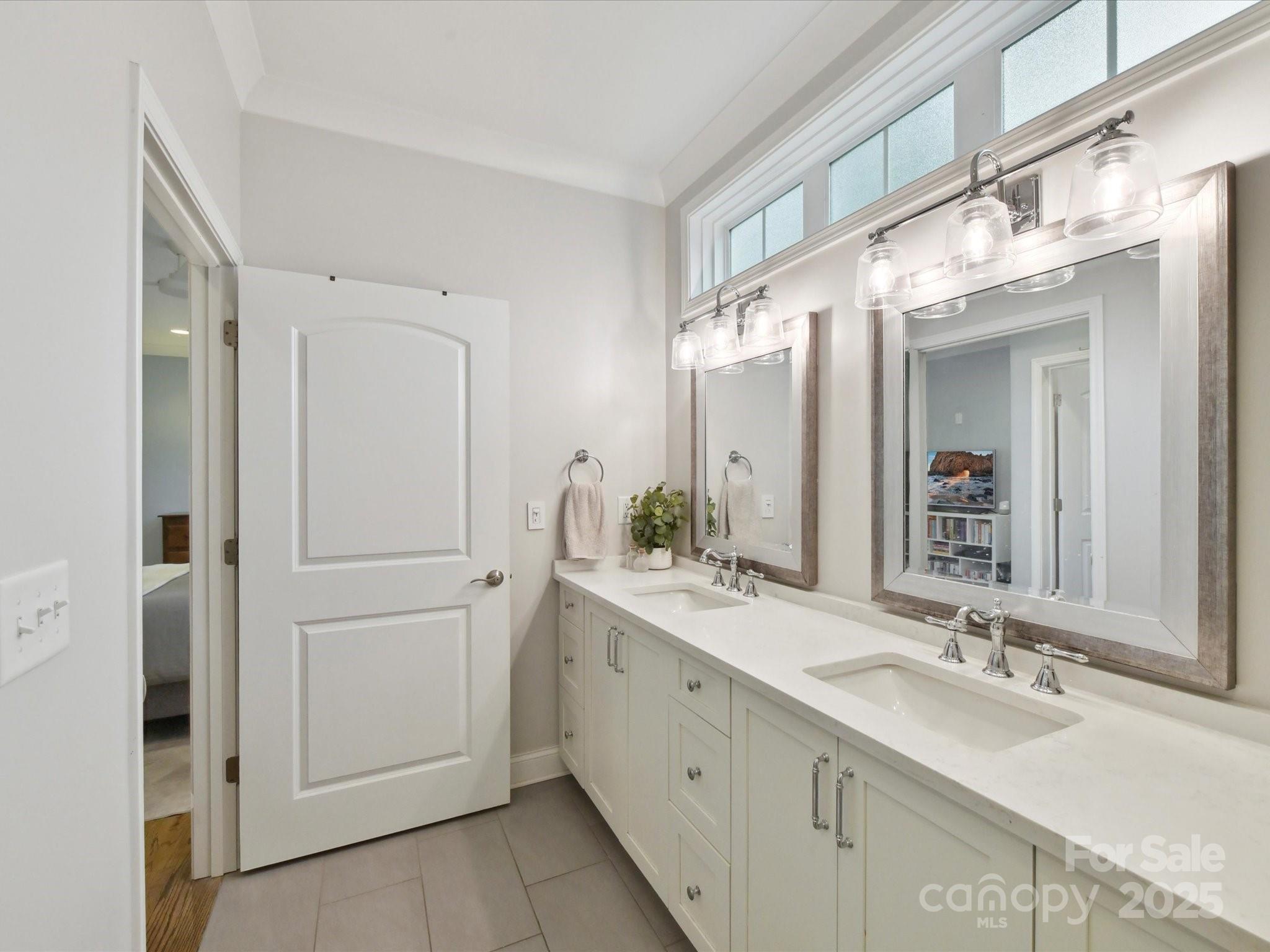 335 Greystone Road Charlotte, NC 28209 - Photo 21 of 37 a bathroom with a double vanity sink mirror and