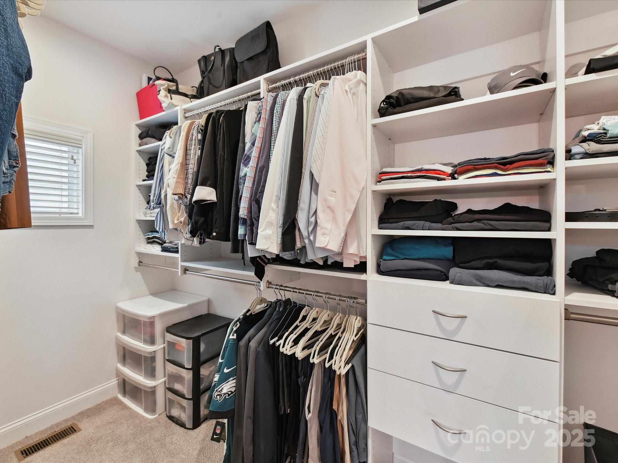 335 Greystone Road Charlotte, NC 28209 - Photo 22 of 37 a view of walk in closet with clothes and shoes