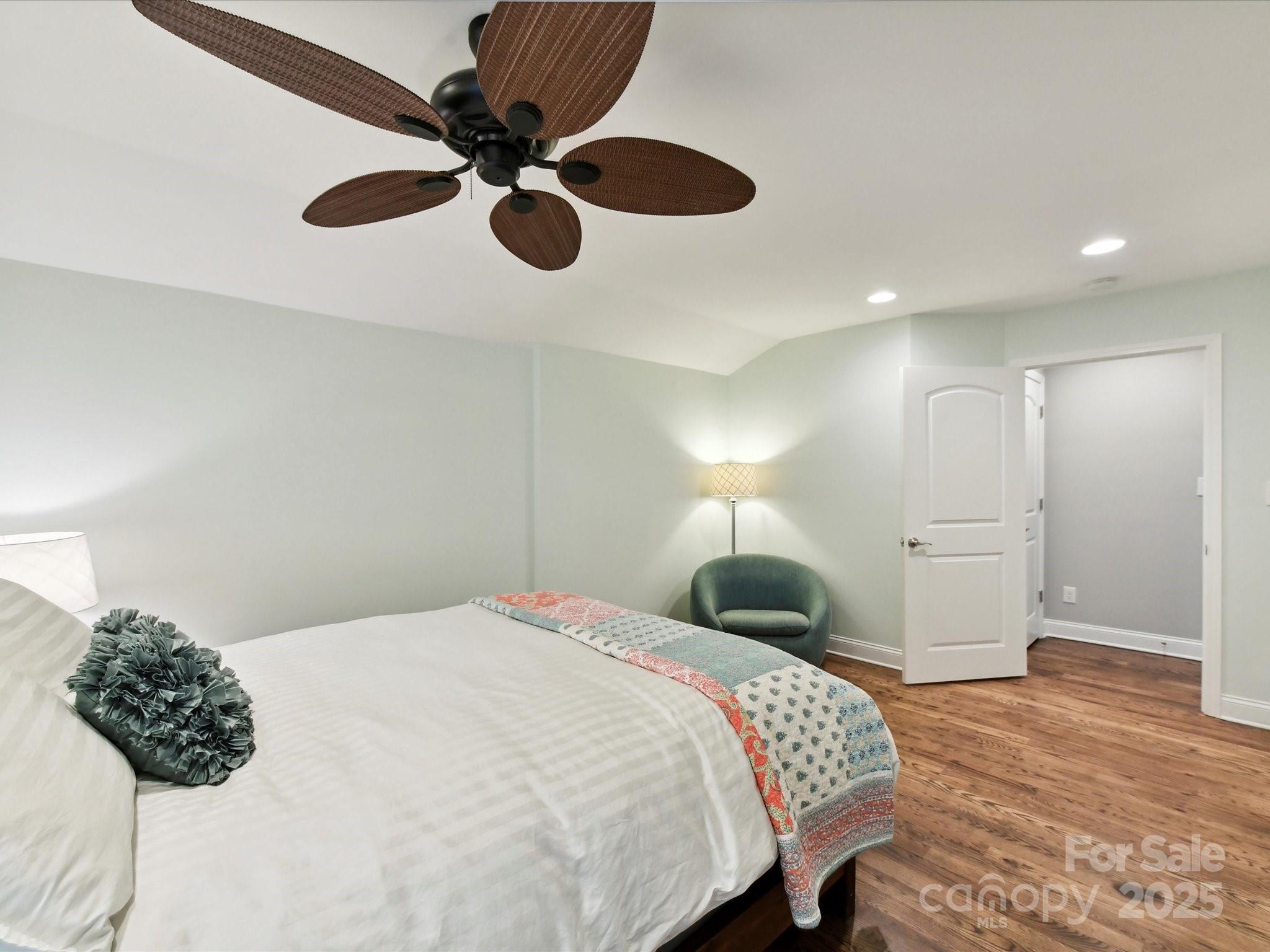 335 Greystone Road Charlotte, NC 28209 - Photo 24 of 37 a bedroom with a bed and a chandelier
