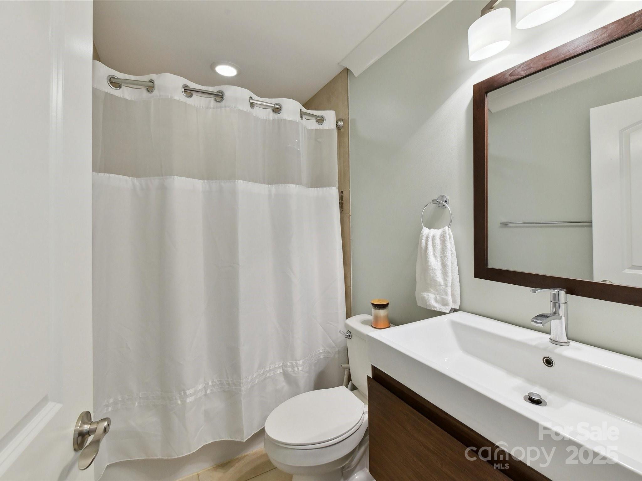 335 Greystone Road Charlotte, NC 28209 - Photo 29 of 37 a bathroom with a sink toilet and shower