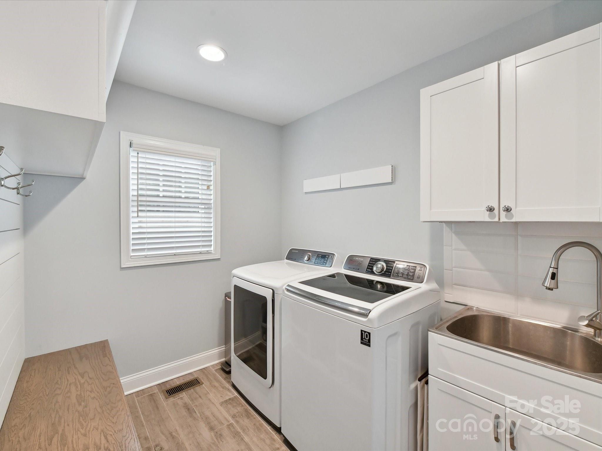 335 Greystone Road Charlotte, NC 28209 - Photo 30 of 37 a kitchen that has a sink and a stove