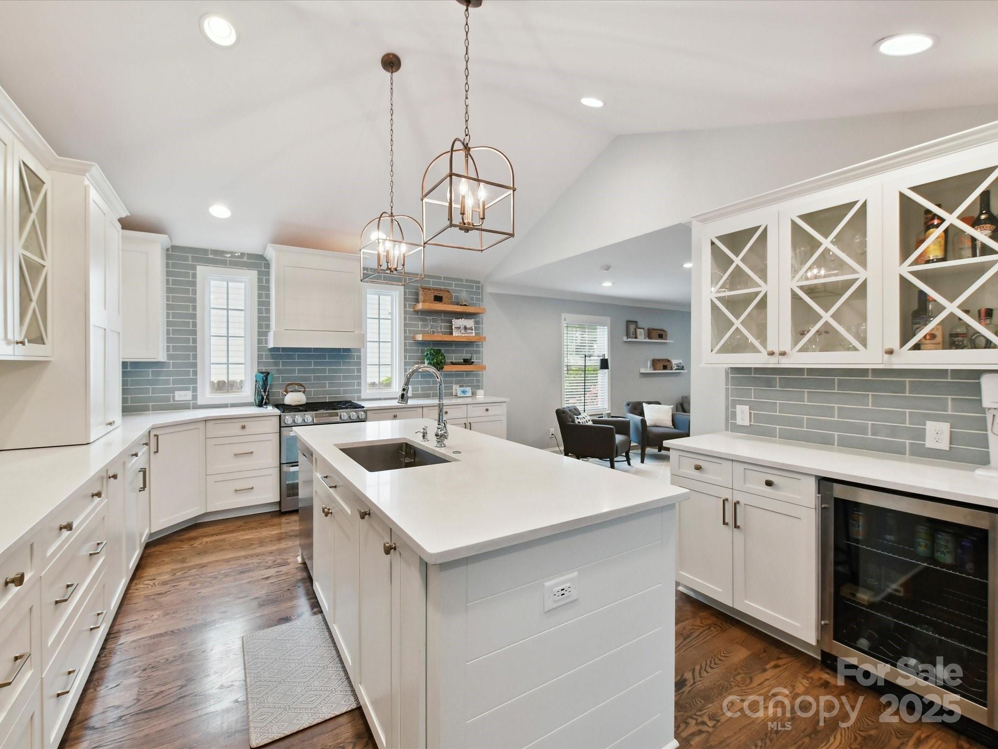 335 Greystone Road Charlotte, NC 28209 - Photo 5 of 37 a kitchen with a sink stove cabinets and wooden floor