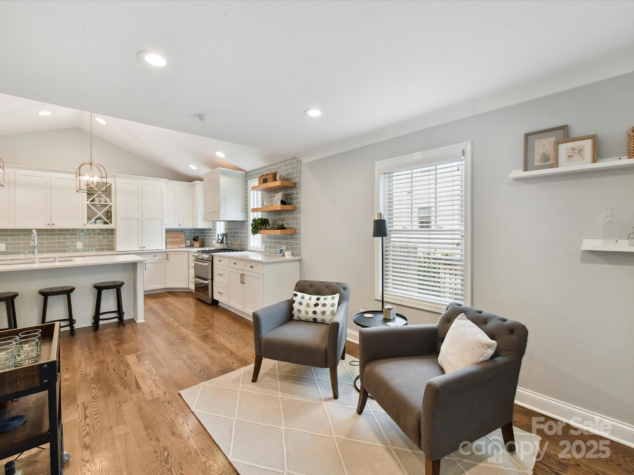 335 Greystone Road Charlotte, NC 28209 - Photo 8 of 37 a living room with furniture and a wooden floor