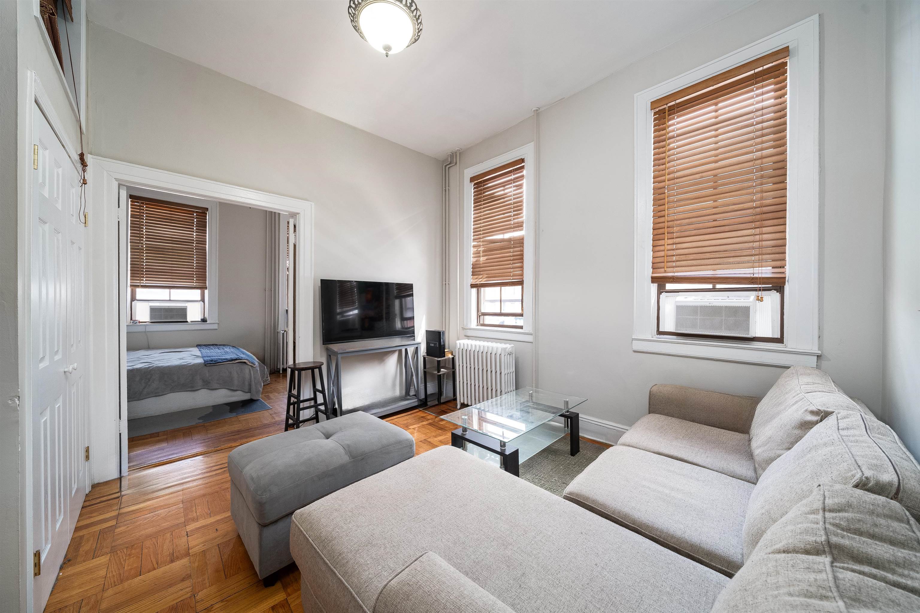 800 Bloomfield Street Hoboken, NJ 07030 - Photo 11 of 38 a living room with furniture and a flat screen tv