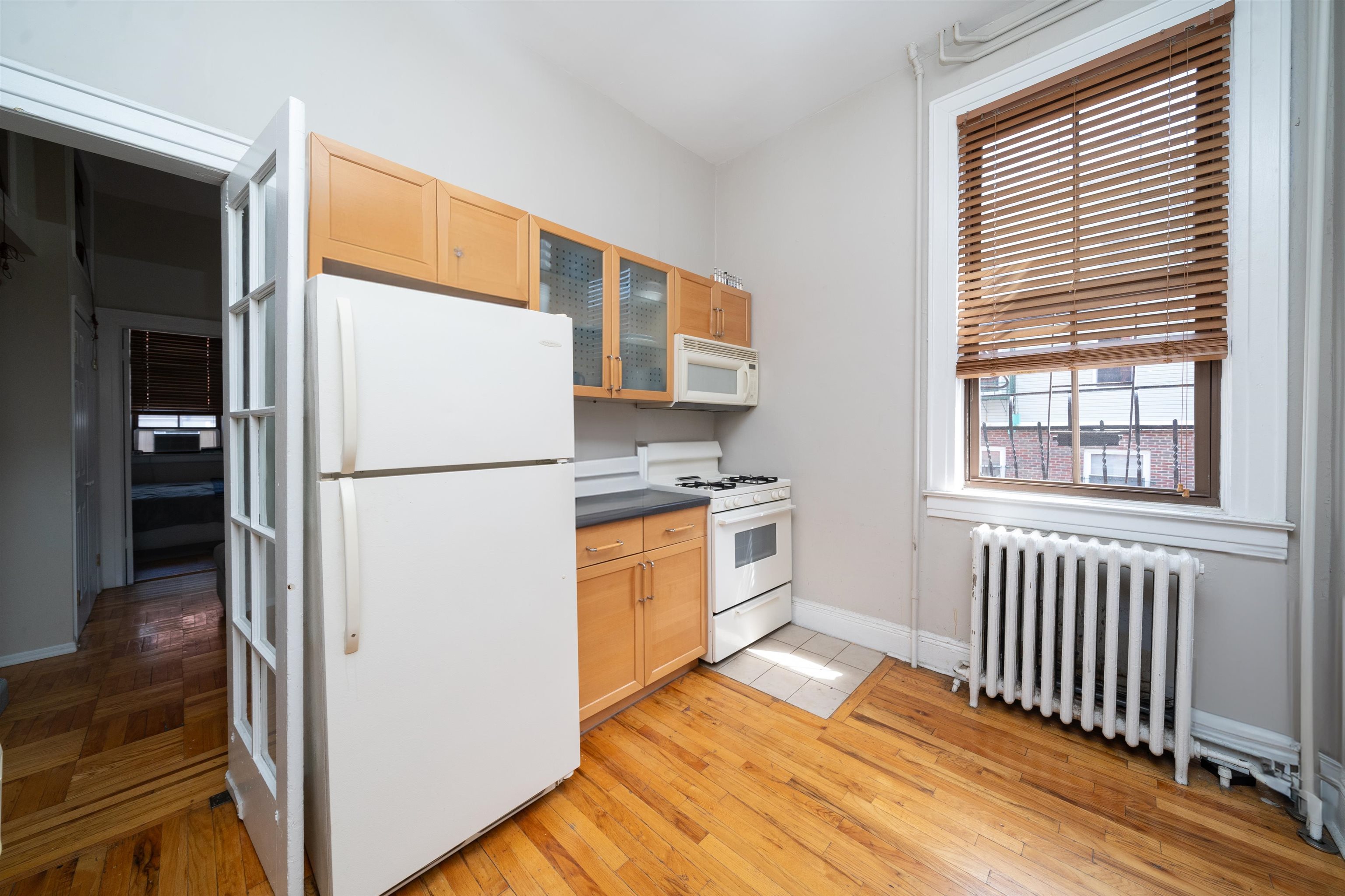 800 Bloomfield Street Hoboken, NJ 07030 - Photo 13 of 38 a kitchen with stainless steel appliances granite countertop a refrigerator and a stove