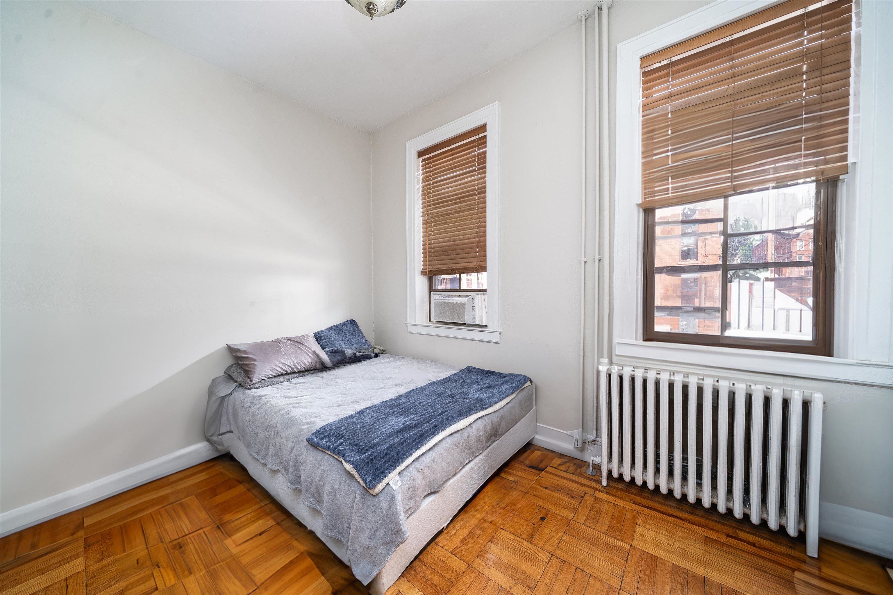 800 Bloomfield Street Hoboken, NJ 07030 - Photo 16 of 38 a bedroom with a bed and a window