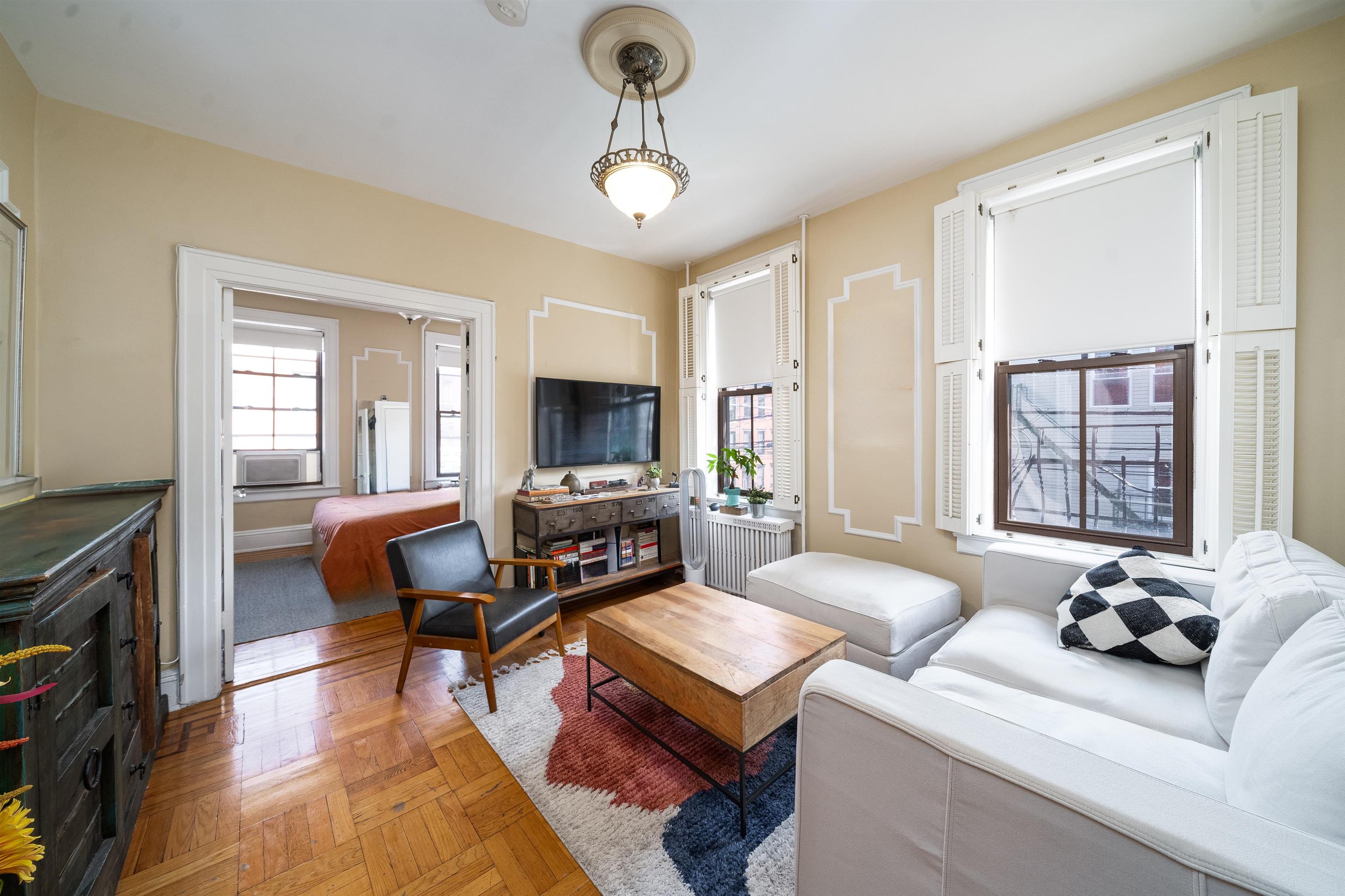 800 Bloomfield Street Hoboken, NJ 07030 - Photo 3 of 38 a living room with furniture and a flat screen tv